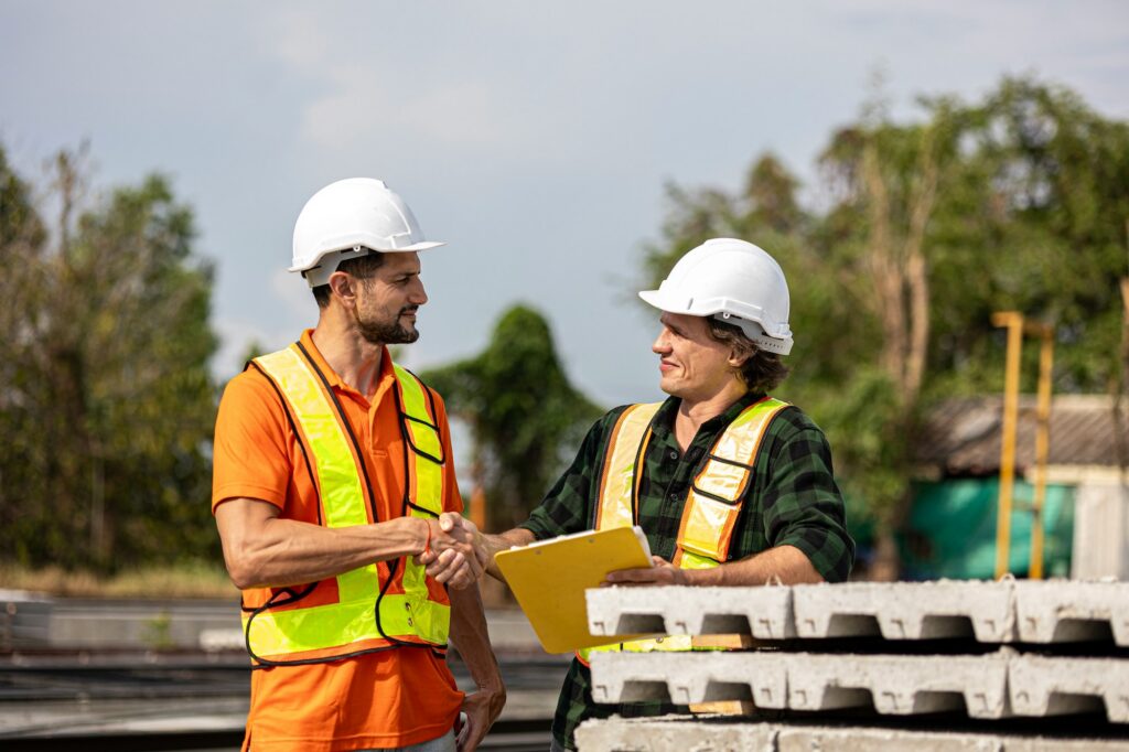 Construction workers in a handshake